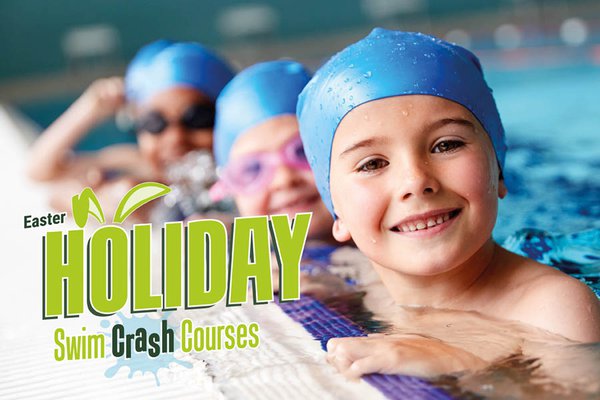 Children swimming in holiday crash course session