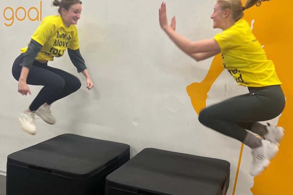 Women performing box jumps in gym for Let's Move campaign